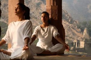 Women practising yoga in the abandoned town of Bhangarh, Alwar, Rajasthan, India, Asia