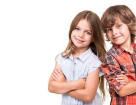 Cool little kids posing over white background